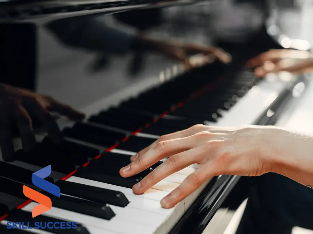 Image of someone playing the piano with the text "learn to play piano" - continue learning after college.