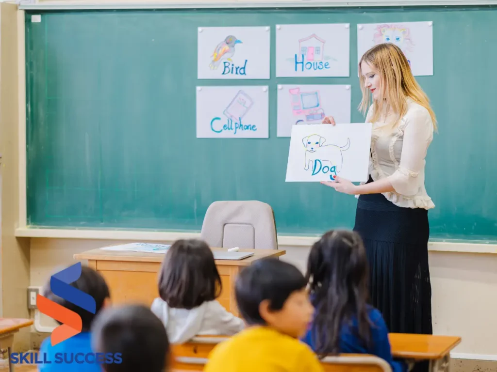 An instructor guiding young students in a classroom setting, emphasizing ongoing education after college