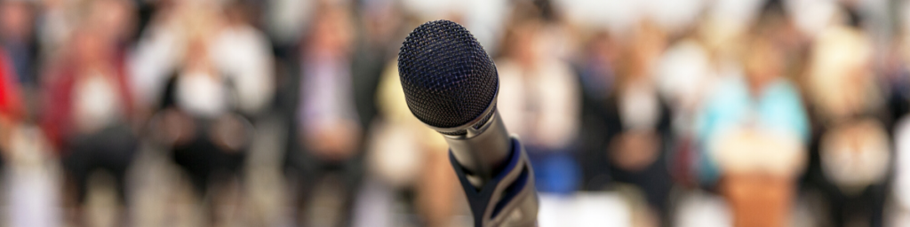 microphone in front of a crowd