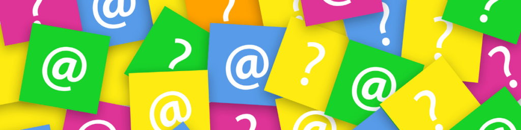 questions-mark-and-email-sign-on-note-pad-papers