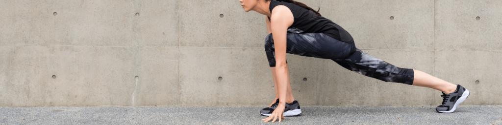 beautiful-runner-woman-stretching-legs-with-lunge