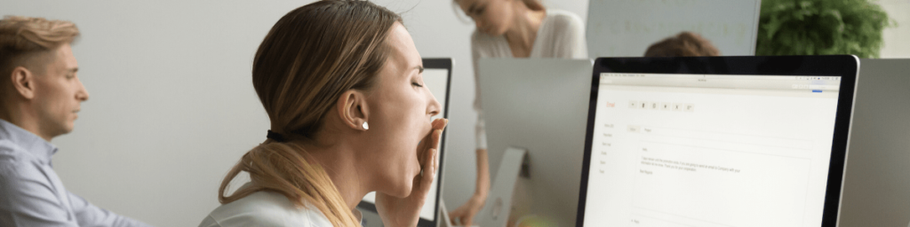 bored-businesswoman-yawning-working