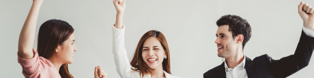 business-people-smile-and-raise-hands-up-feeling-happy