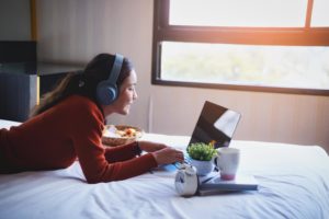 featured-image-happy-beautiful-young-women-working-in-bed-using-laptop-computer-at-home