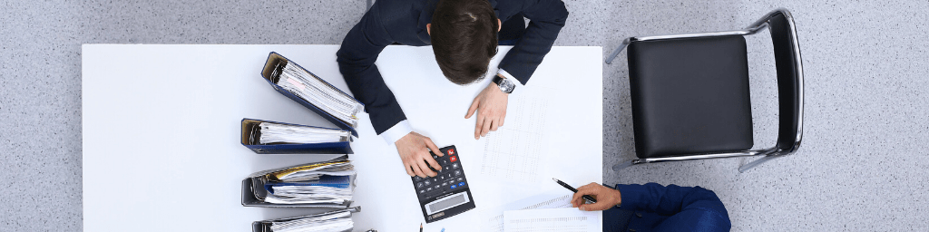 two-businessmen-sitting-at-the-table-view-from-above-bookkeeper-or-financial-inspector-making-report-calculating-or-checking-balanc