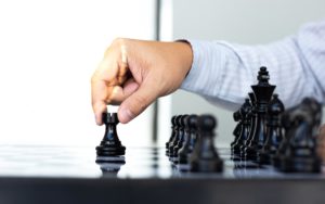 business-strategy-businessman-have-the-skills-to-play-chess-and-be-successful-management-or-leadership-concept