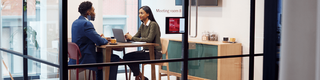 businesswoman-interviewing-male-job-candidate