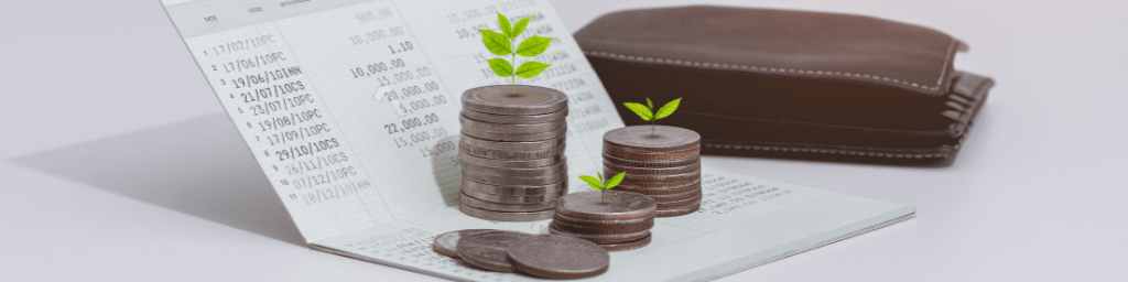stack-of-coins-and-account-book-bank-on-the-table