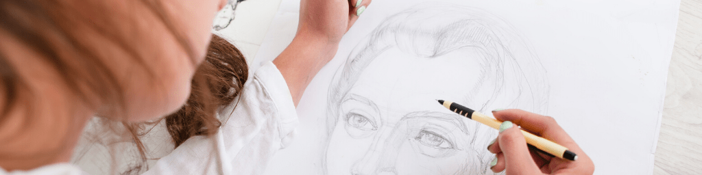 artist drawing pencil portrait close-up
