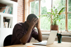 man is frustrated after failing an exam