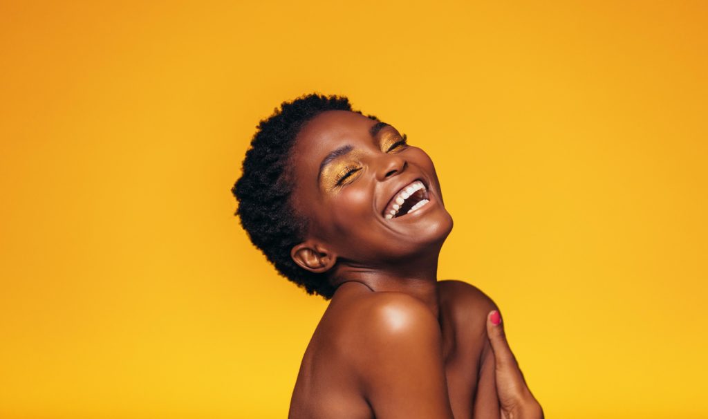 laughing-african-female-model-with-makeup