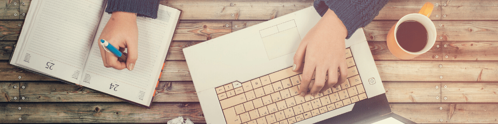 top-view-of-teenager-with-laptop-and-taking-notes-on-wooden-table