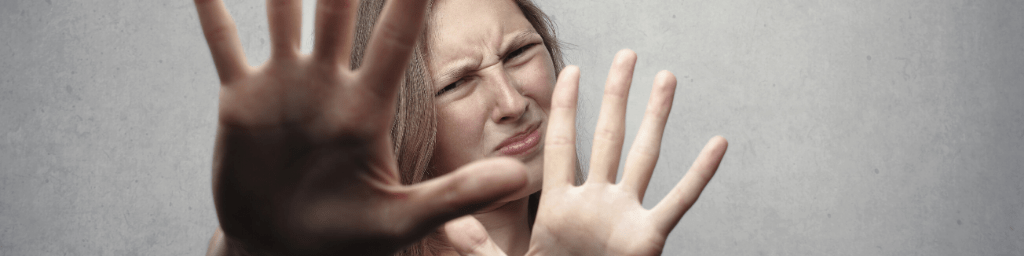 woman-in-gray-tank-top-looking-frightened