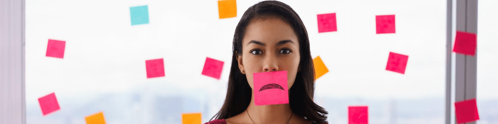 busy-person-holds-sticky-note-on-mouth-with-emoticon