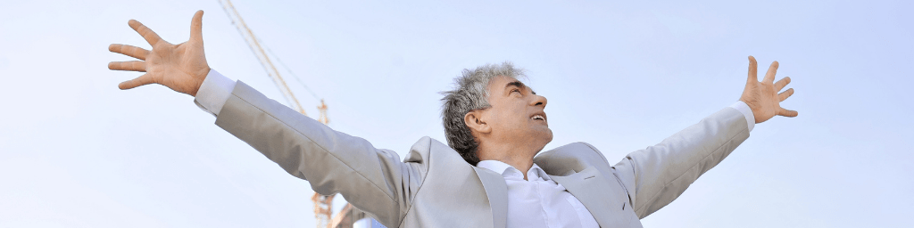 portrait-of-a-businessman-with-arms-open-career-development-goal