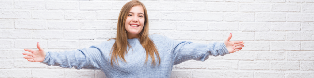 spreading your arms wide open is a form of positive body language