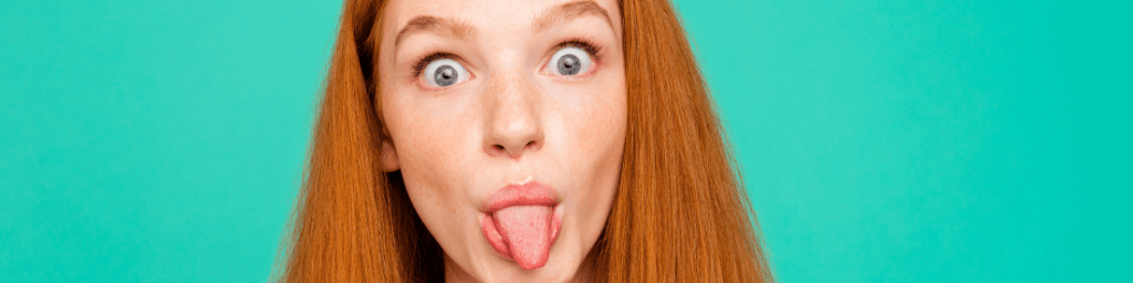 portrait-of-humorous-stunning-adorable-good-looking-young-woman-show-though-out-and-big-eyes-fooling-around-isolated-on-vivid-mint-background