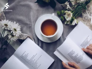 a cup of tea with books of poems