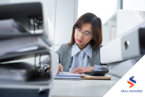 medical-assistant-performing-bookkeeping-in-an-office
