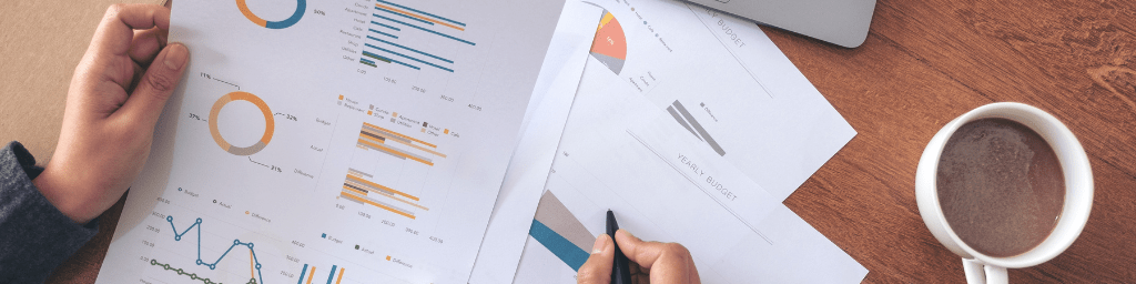 businesswoman-writing-and-working-on-business-data-and-document