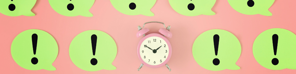 soft-skills-time-management-alarm-clock-on-pink-background-many-yellow-stickers-with-exclamation-marks