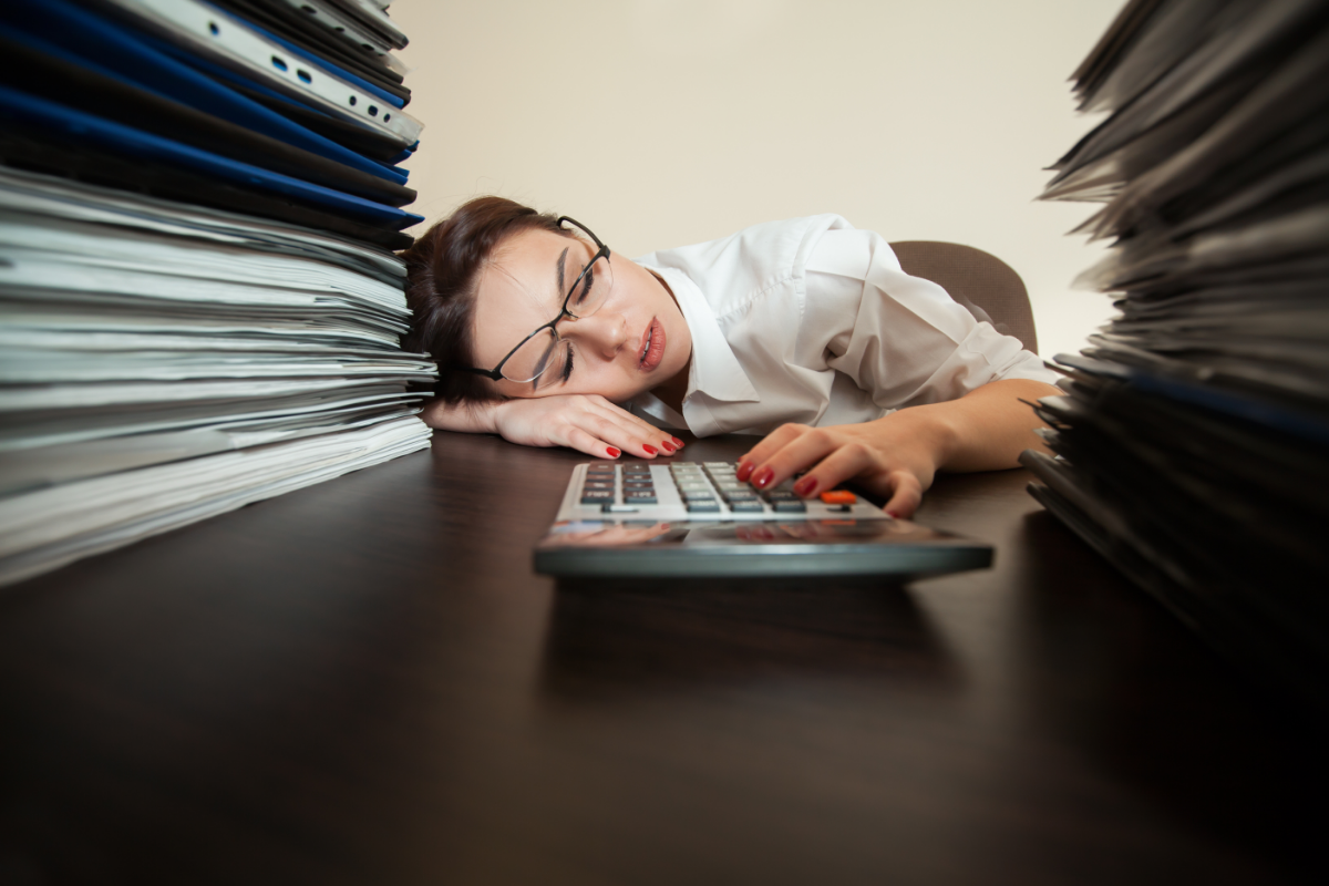 tired-bookkeeper-fell-asleep-while-doing-financial-reports