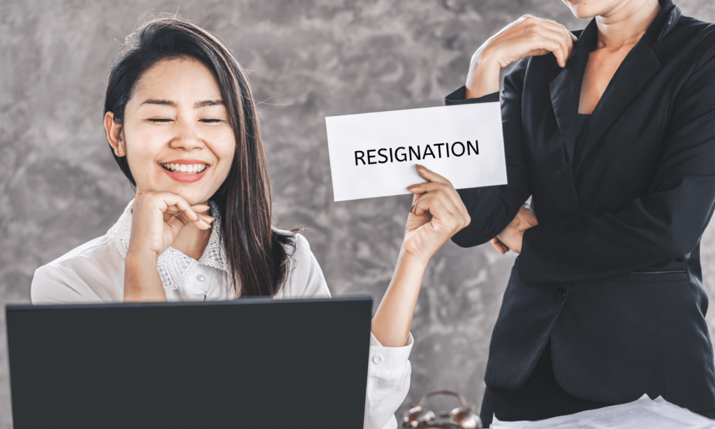 happy-asian-female-worker-giving-resignation-latter-to-annoying-boss-quitting-a-job