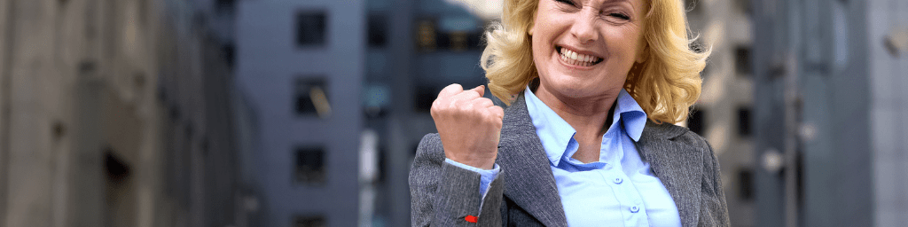 happy-female-boss-showing-success-gesture-work-achievement-business-goals