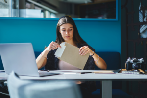 woman-opening-a-letter