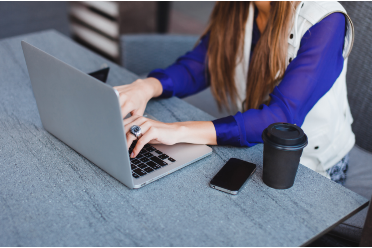 woman typing on a laptop