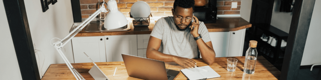 man working an online job at home