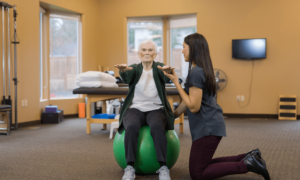a-senior-woman-works-with-her-occupational-therapist-assistant