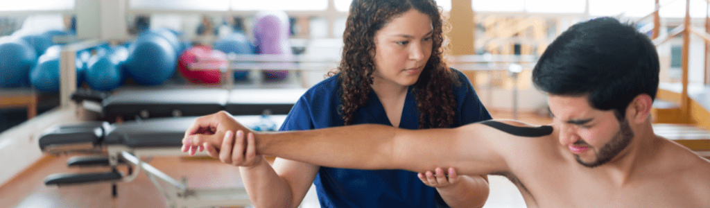 occupational-therapist-assistant-holding-and-stretching-patient-s-arm