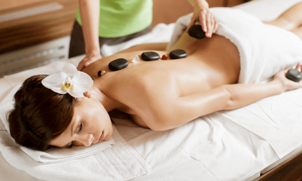 massage-therapist-massaging-a-female-client-s-back