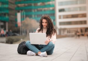 Woman creating cover letter on laptop