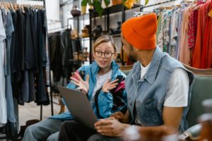 excited amazon merchant looking at laptop