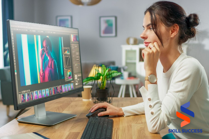 female photographer editing on computer