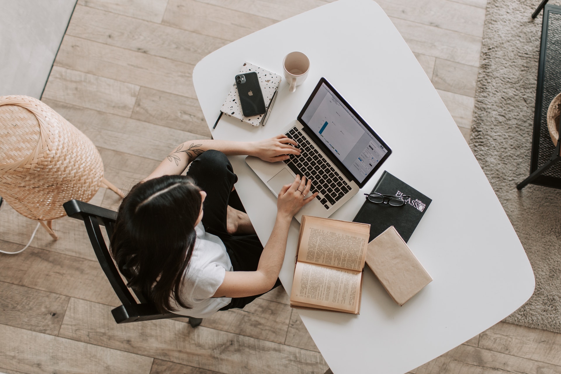 woman studying online program through laptop
