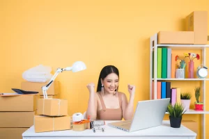 Business owner working at home office packaging