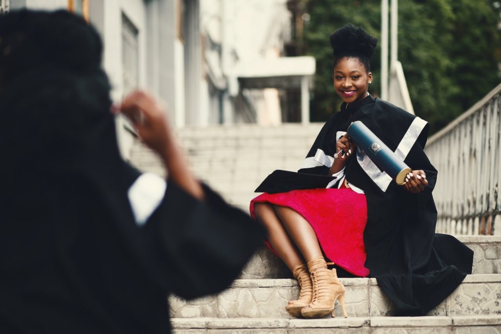 scholar in black toga graduation