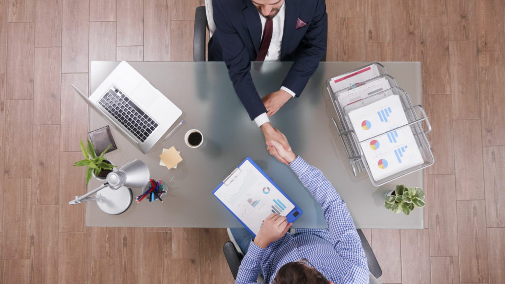 business man and client shaking hands