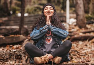 woman sitting on ground meditating intuition quotes