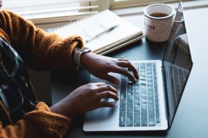 freelancer using black and silver laptop computer