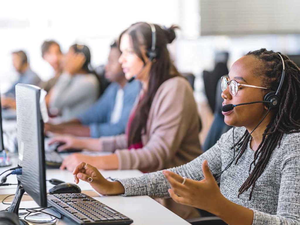 Customer service associate talking desktop
