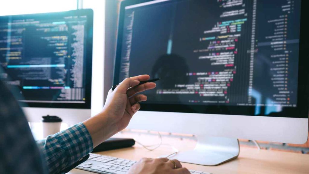 Software Developer Job Desktop Monitors Pen Pointing