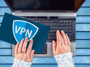 VPN freelancer typing on laptop