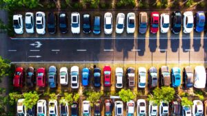 Employee Parking Cars in Parking Spaces