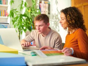 Benefits of Tutoring - Tutor Working With Student