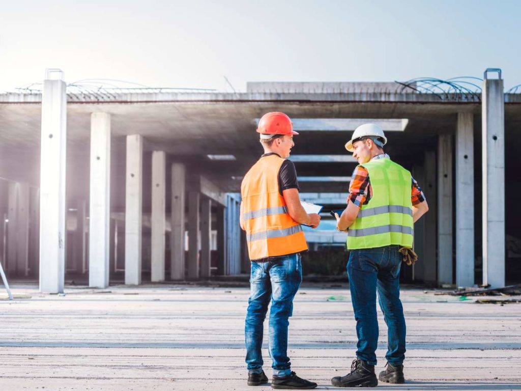 two facility managers talking