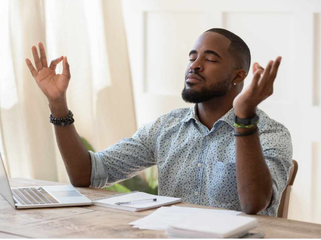 employee practicing mindfulness exercise at work